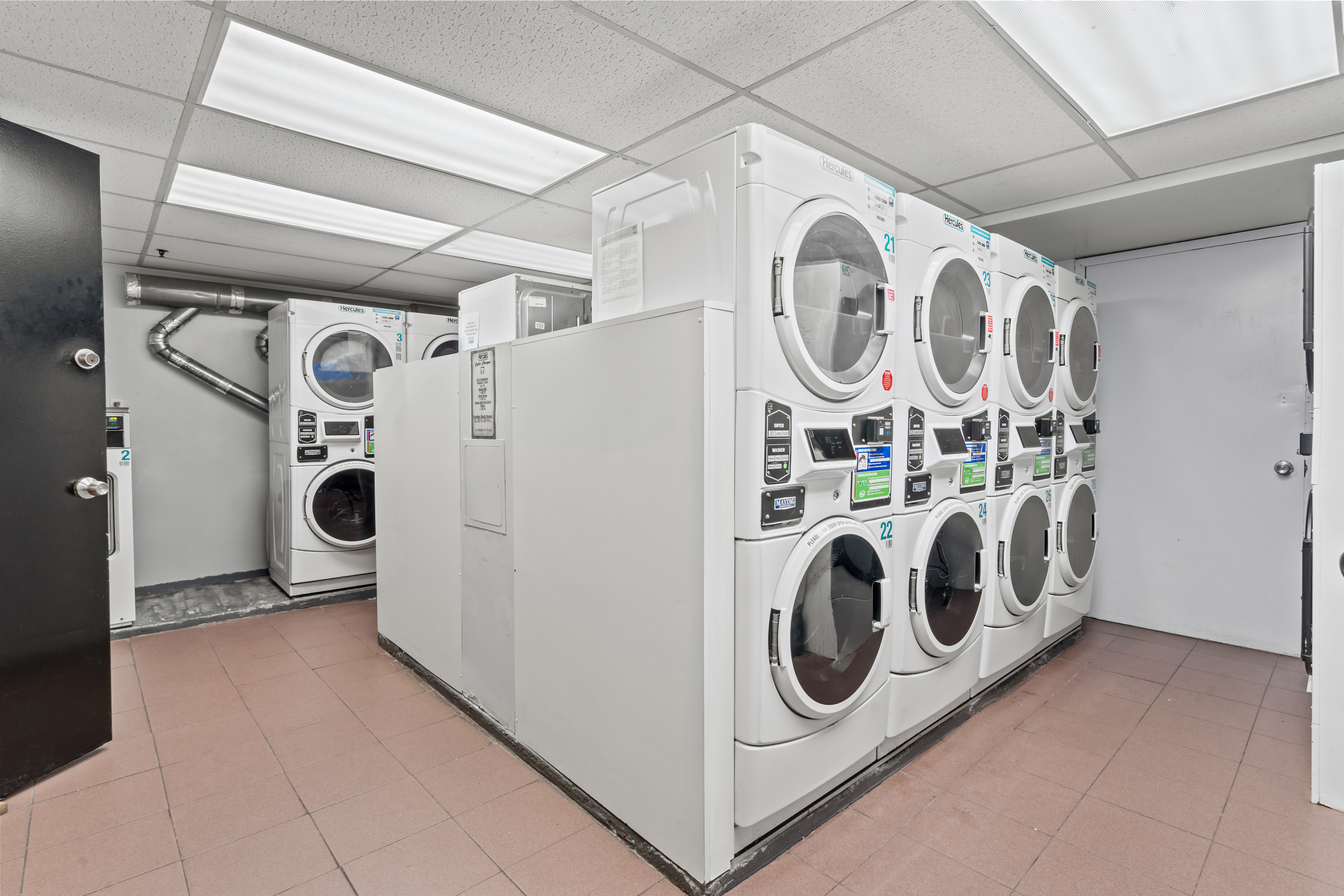 45 Tudor City Place, Unit 1708 Manhattan, NY 10017 - Photo 11 of 14 a utility room with dryer and washer