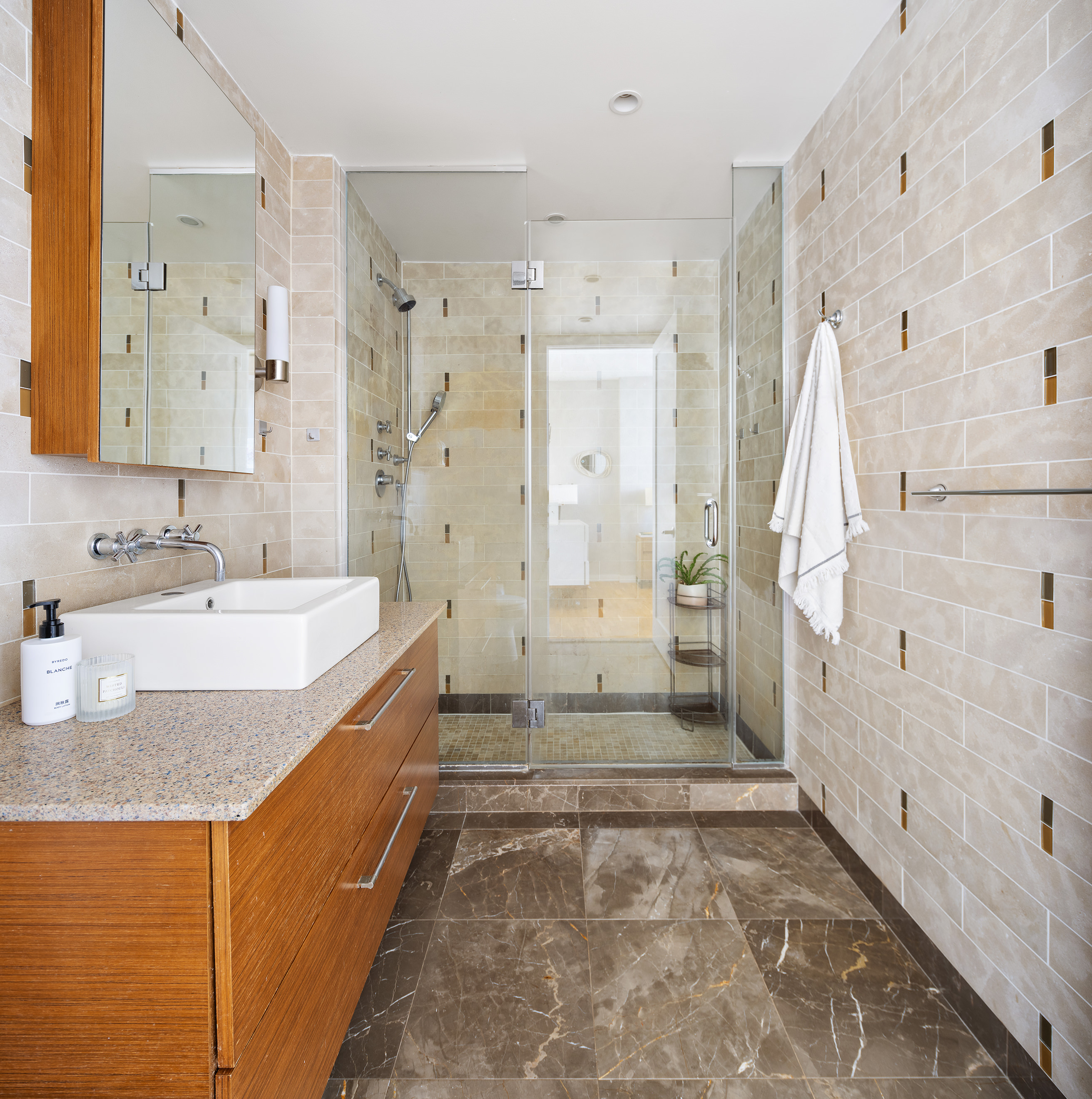 500 4th Avenue, Unit 7C Brooklyn, NY 11215 - Photo 6 of 12 a bathroom with a granite countertop sink and shower