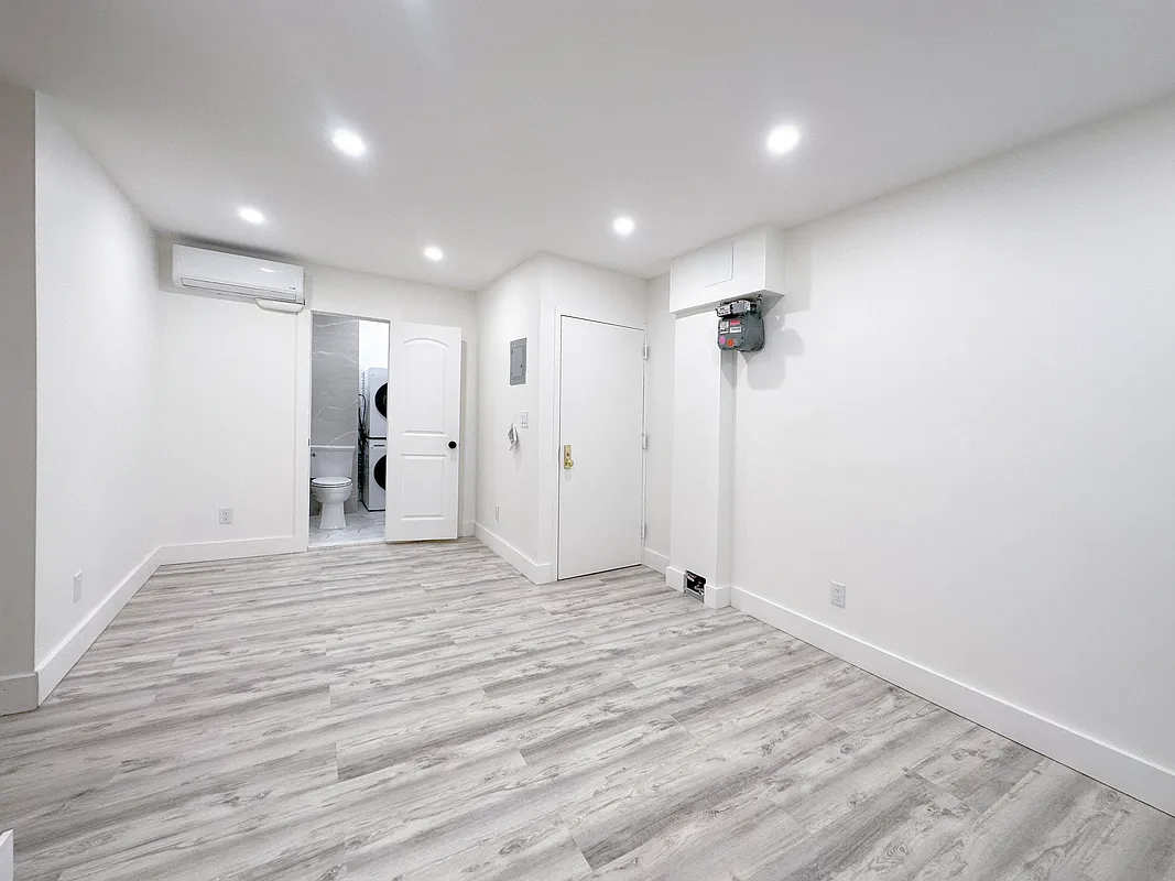 55 Spring Street, Unit 7 Manhattan, NY 10012 - Photo 6 of 12 a view of empty room with wooden floor