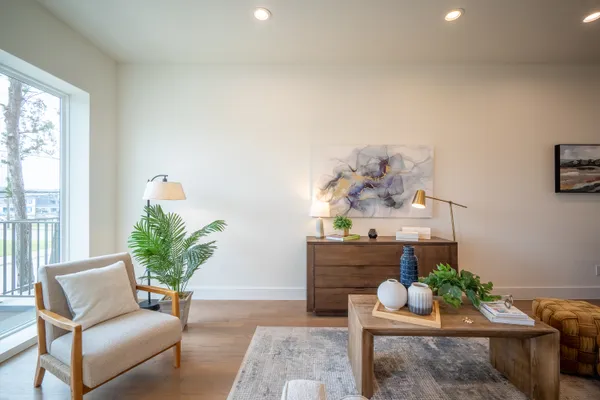 a living room with furniture and a table