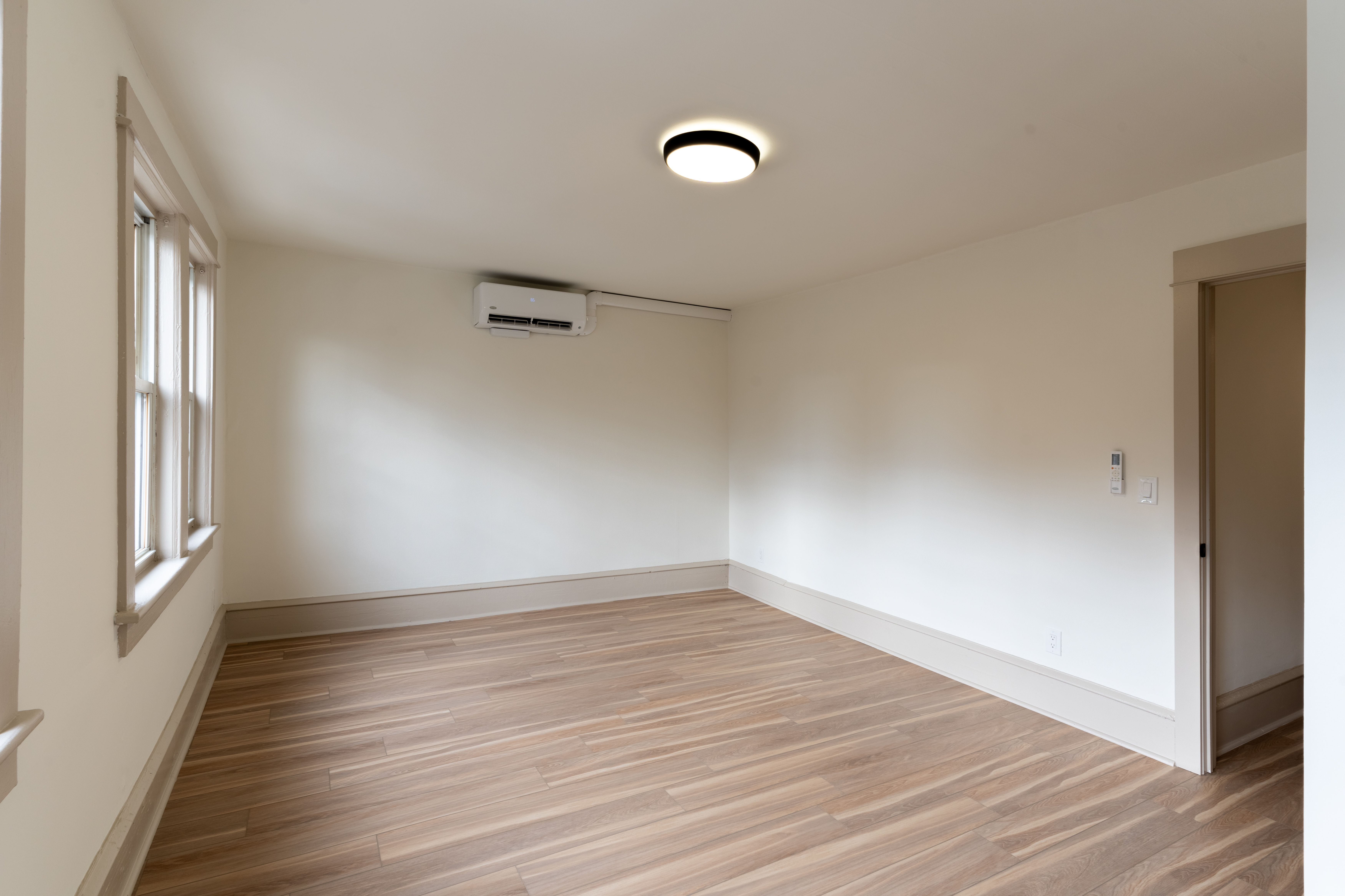 423 North Haddon Avenue Haddonfield, NJ 08033 - Photo 11 of 16 wooden floor in an empty room with a window