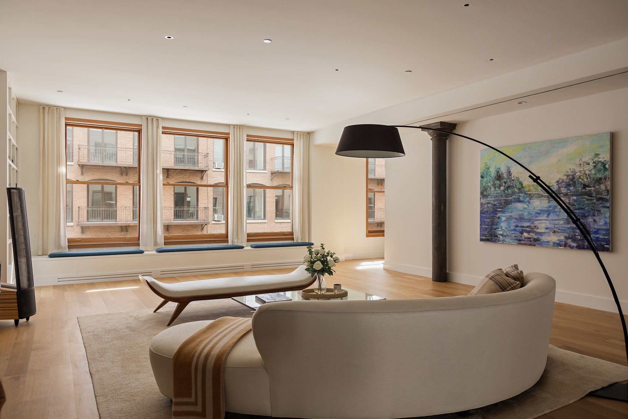 101 Wooster Street, Unit 3F/4F Manhattan, NY 10012 - Photo 2 of 24 a living room with furniture and large windows