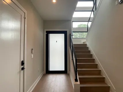 a view of an empty room with a window