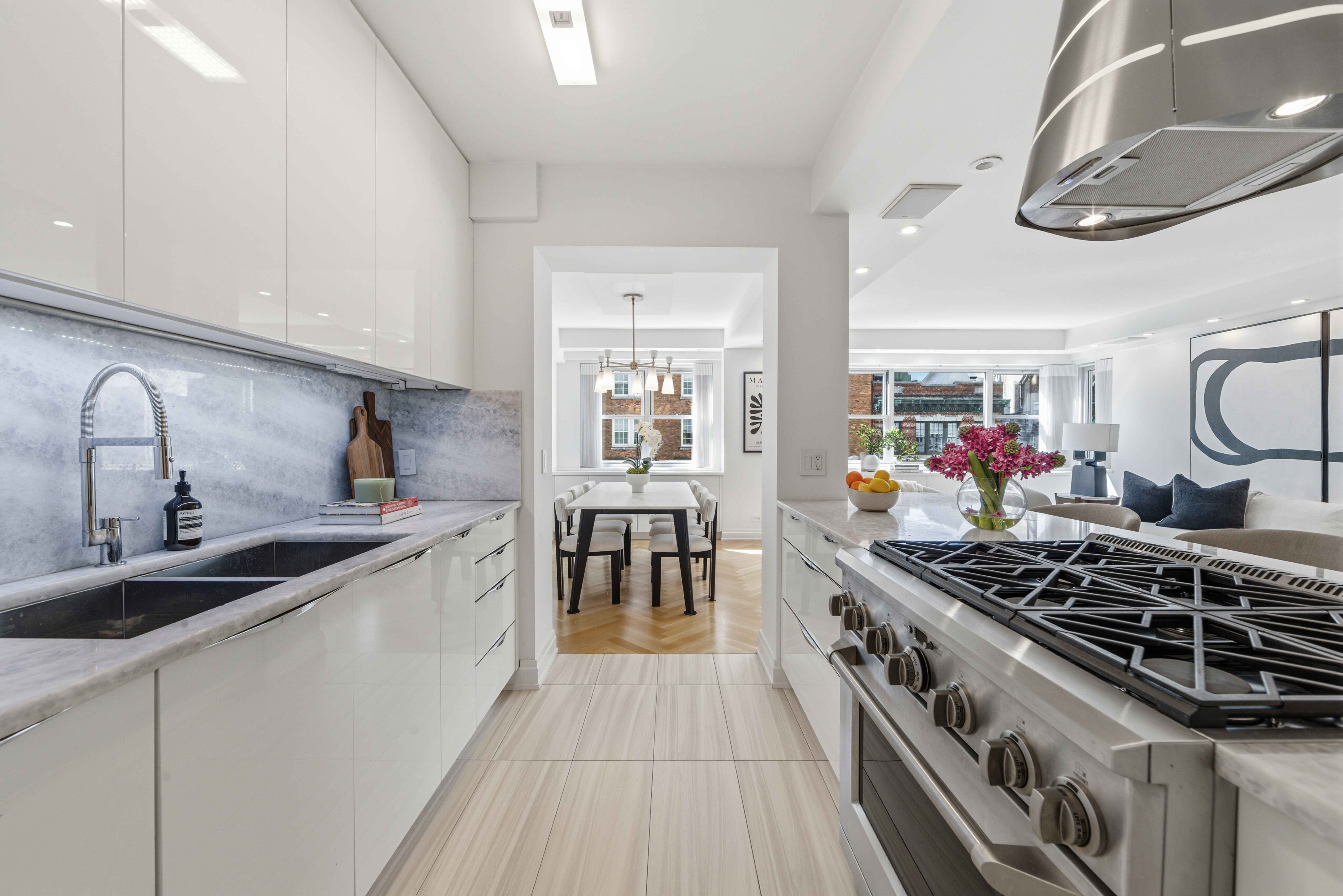 40 East 78th Street, Unit 5E Manhattan, NY 10075 - Photo 7 of 23 a kitchen with a stove and a sink