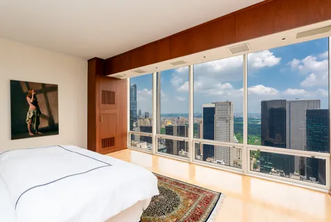 a view of a kitchen with a sink and cabinets