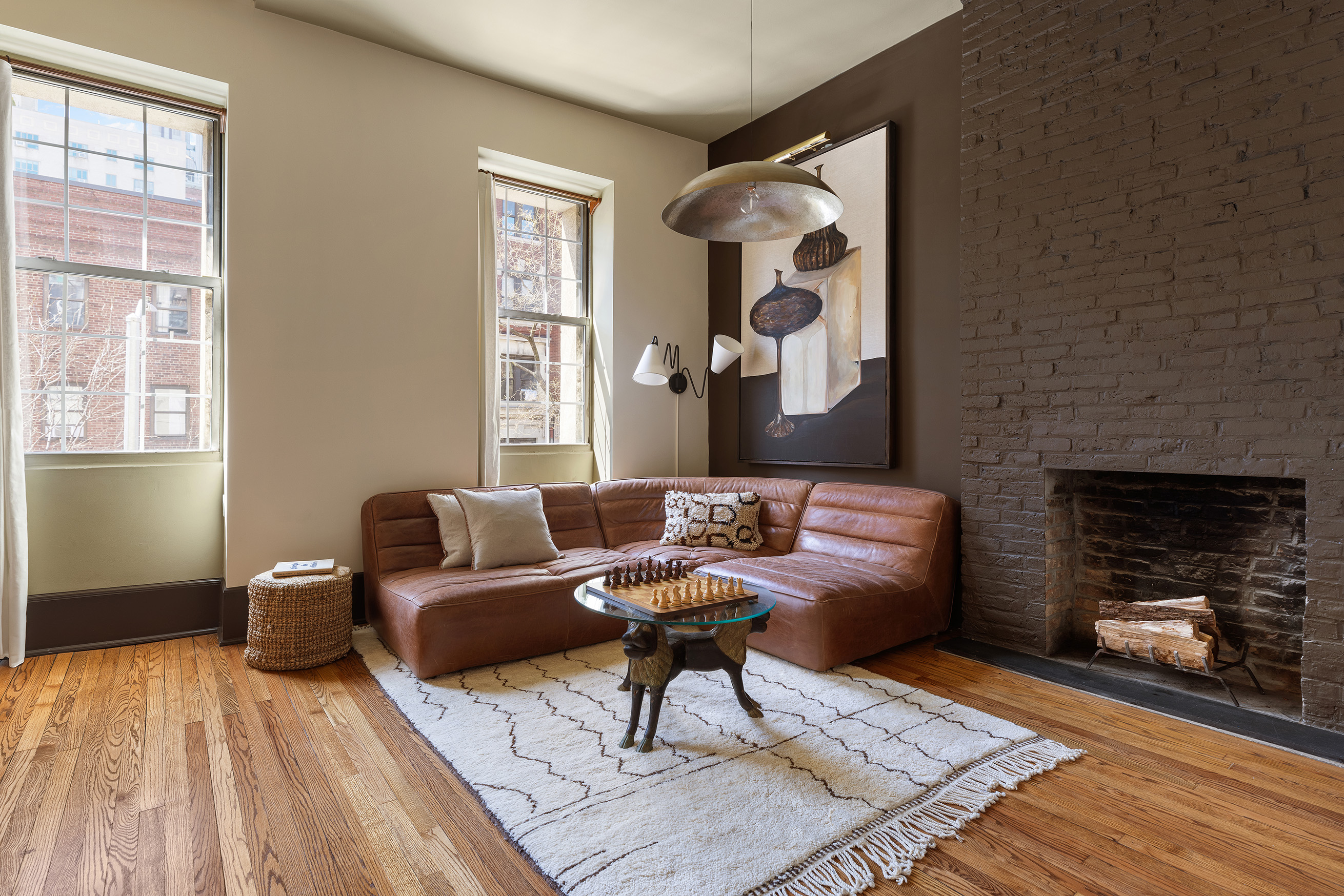207 West 21st Street, Unit 3F Manhattan, NY 10011 - Photo 3 of 12 a living room with furniture and a fireplace