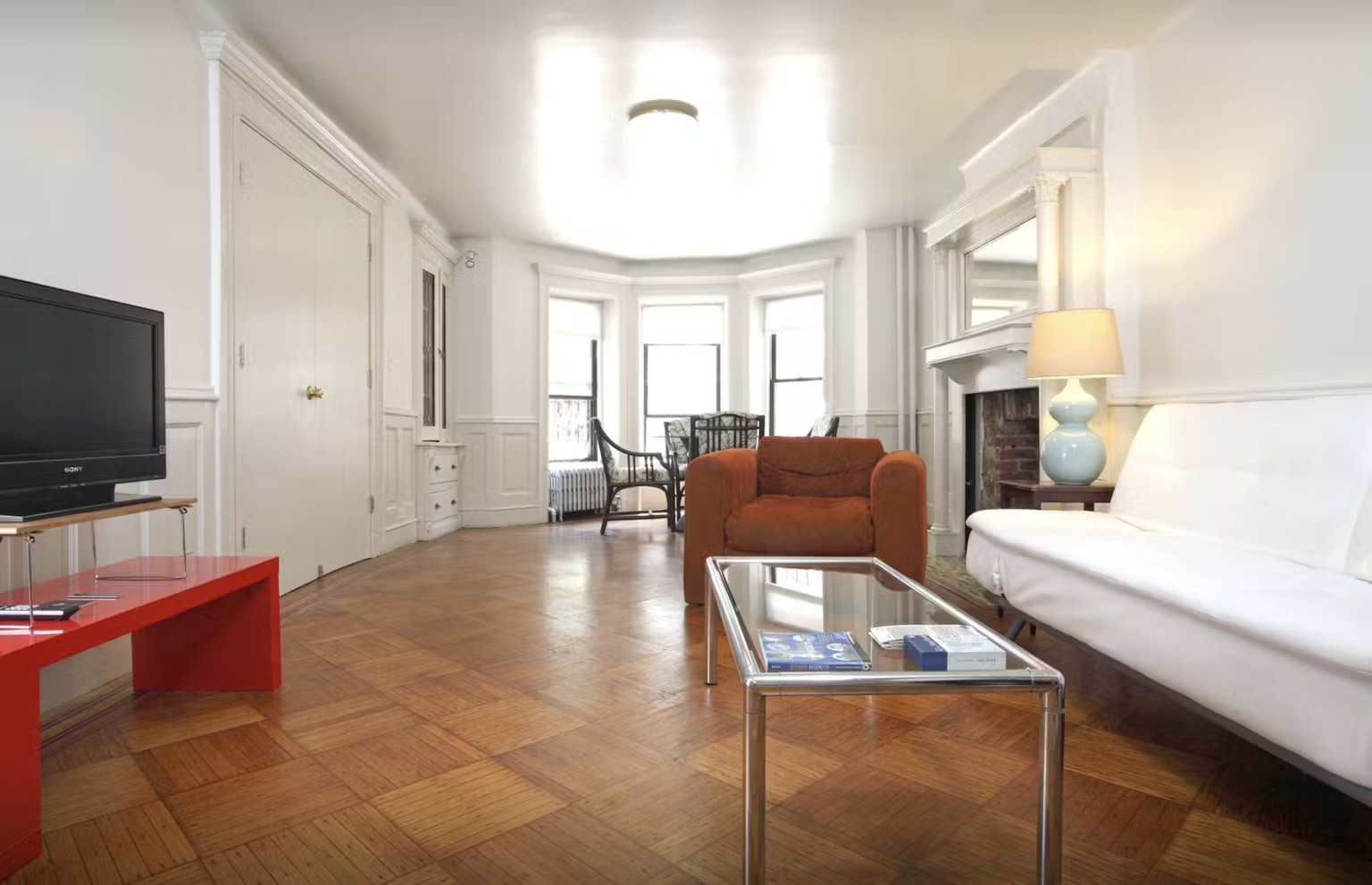 899 Lincoln Place, Unit 1 Brooklyn, NY 11213 - Photo 2 of 9 a living room with furniture and a flat screen tv