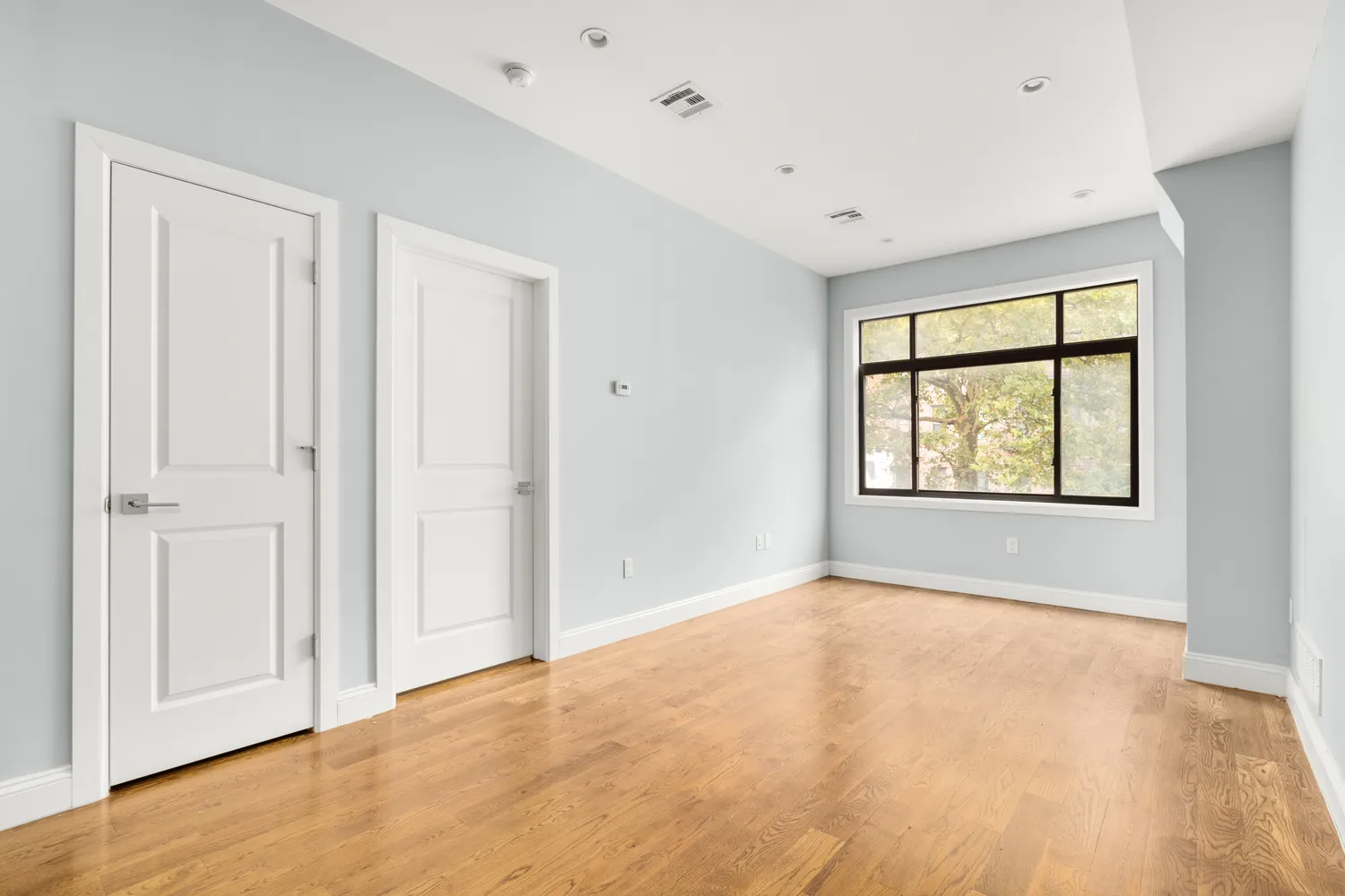 a view of an empty room with a window