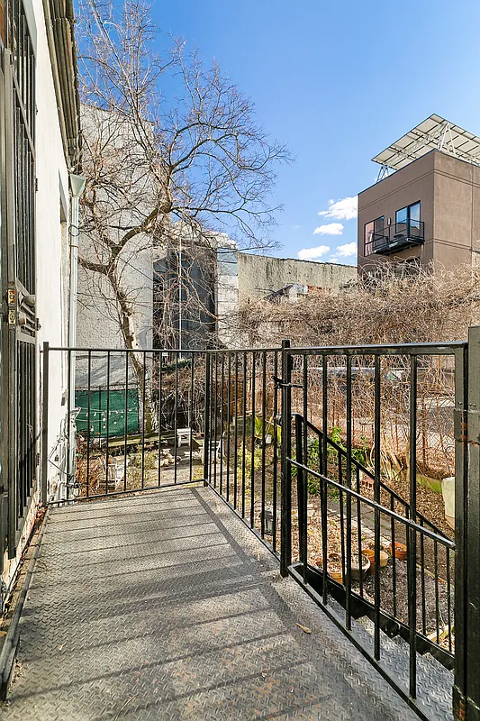 1100 Dean Street, Unit 4 Brooklyn, NY 11216 - Photo 11 of 13 a view of a brick building from a balcony