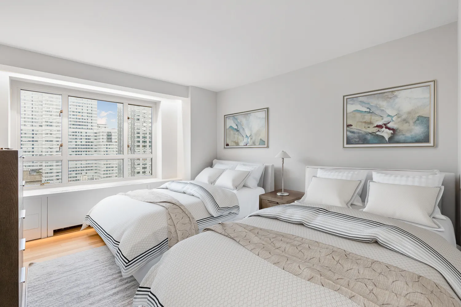 a bedroom with bed and a large window