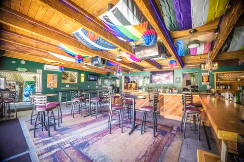 a bathroom with a sink a mirror and a toilet