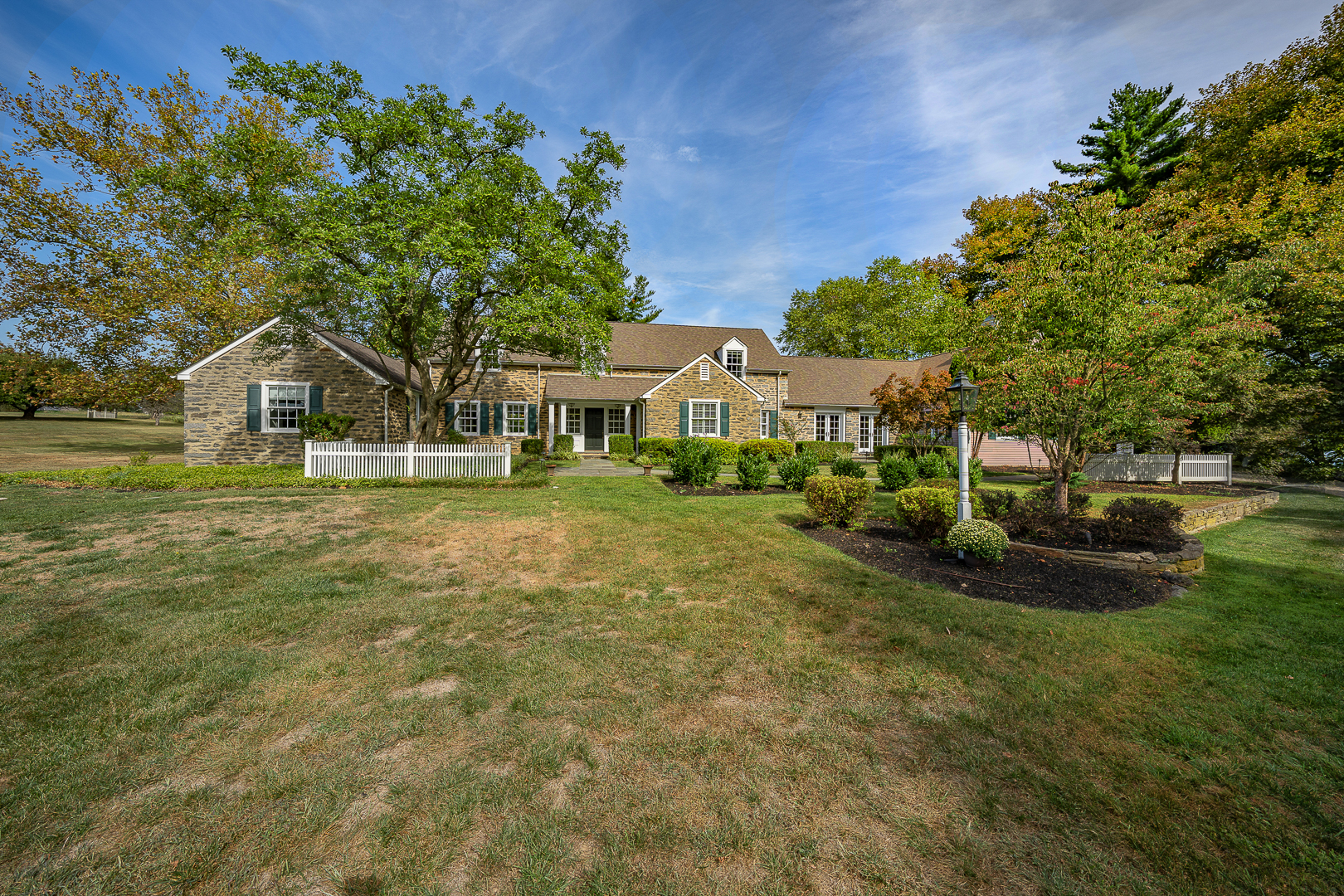 6007 Cricket Road Flourtown, PA 19031 - Photo 3 of 4 a front view of a house with a garden