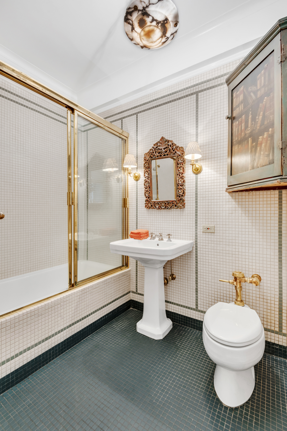 115 Central Park West, Unit 3B Manhattan, NY 10023 - Photo 12 of 20 a bathroom with a sink toilet and shower