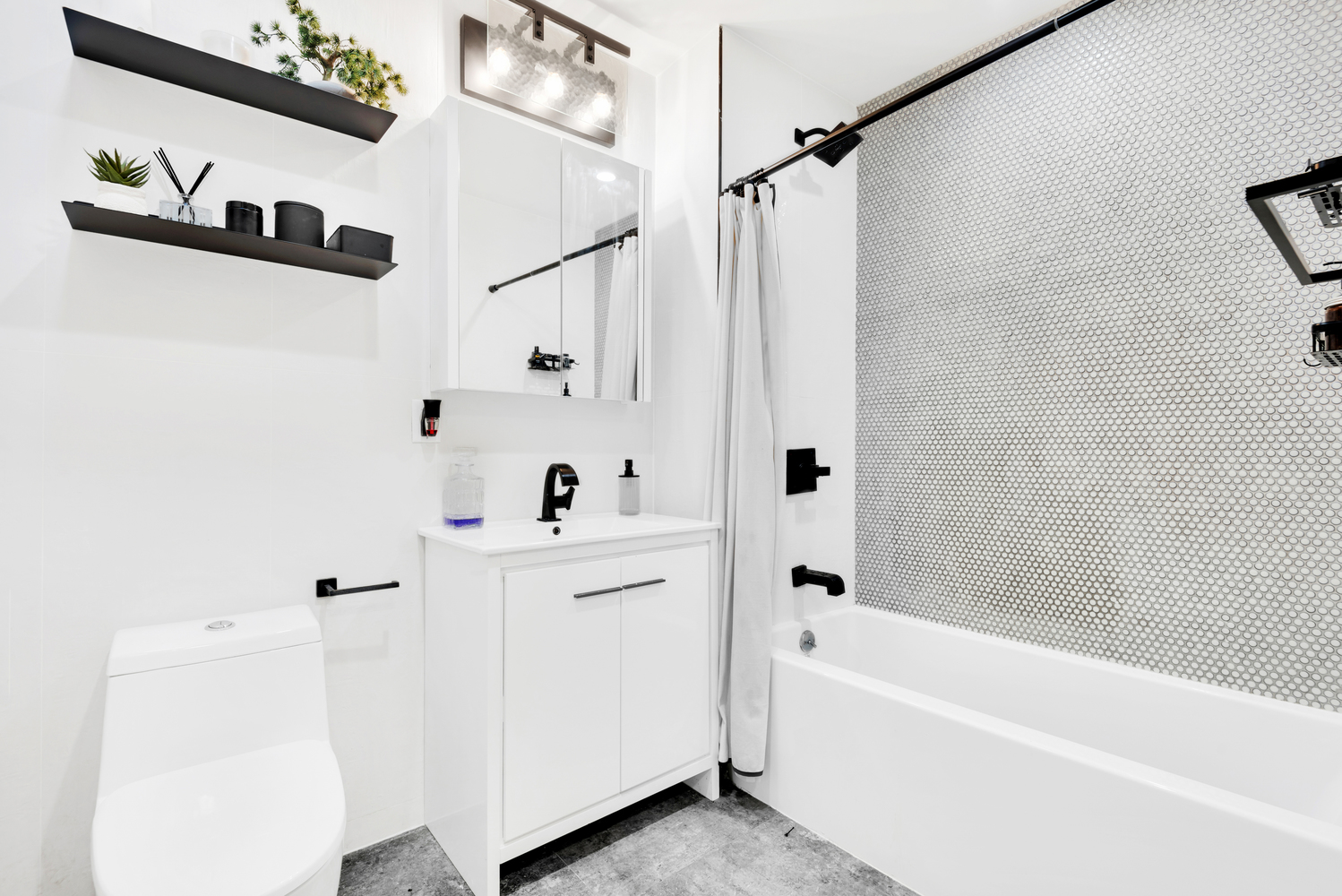 1325 Herkimer Street, Unit 404 Brooklyn, NY 11233 - Photo 4 of 6 a bathroom with a bathtub a shower a sink and a window