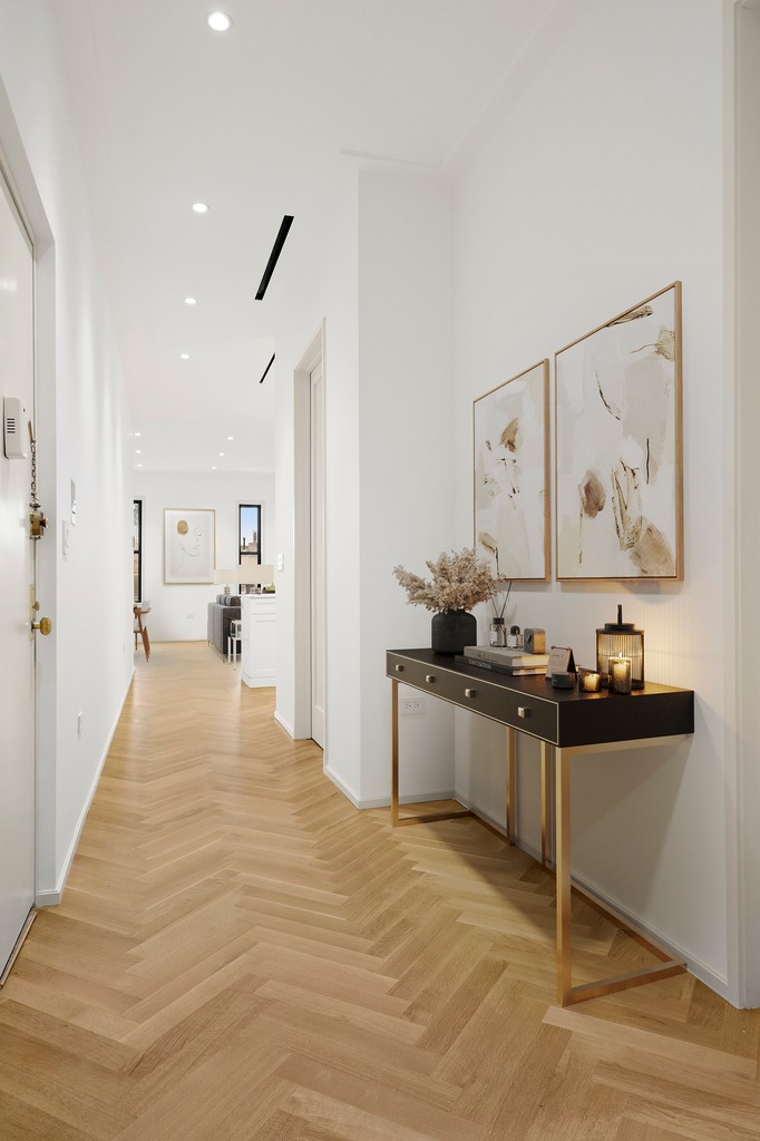 214 Clinton Street, Unit 2E Brooklyn, NY 11201 - Photo 4 of 11 a room with a bed and furniture