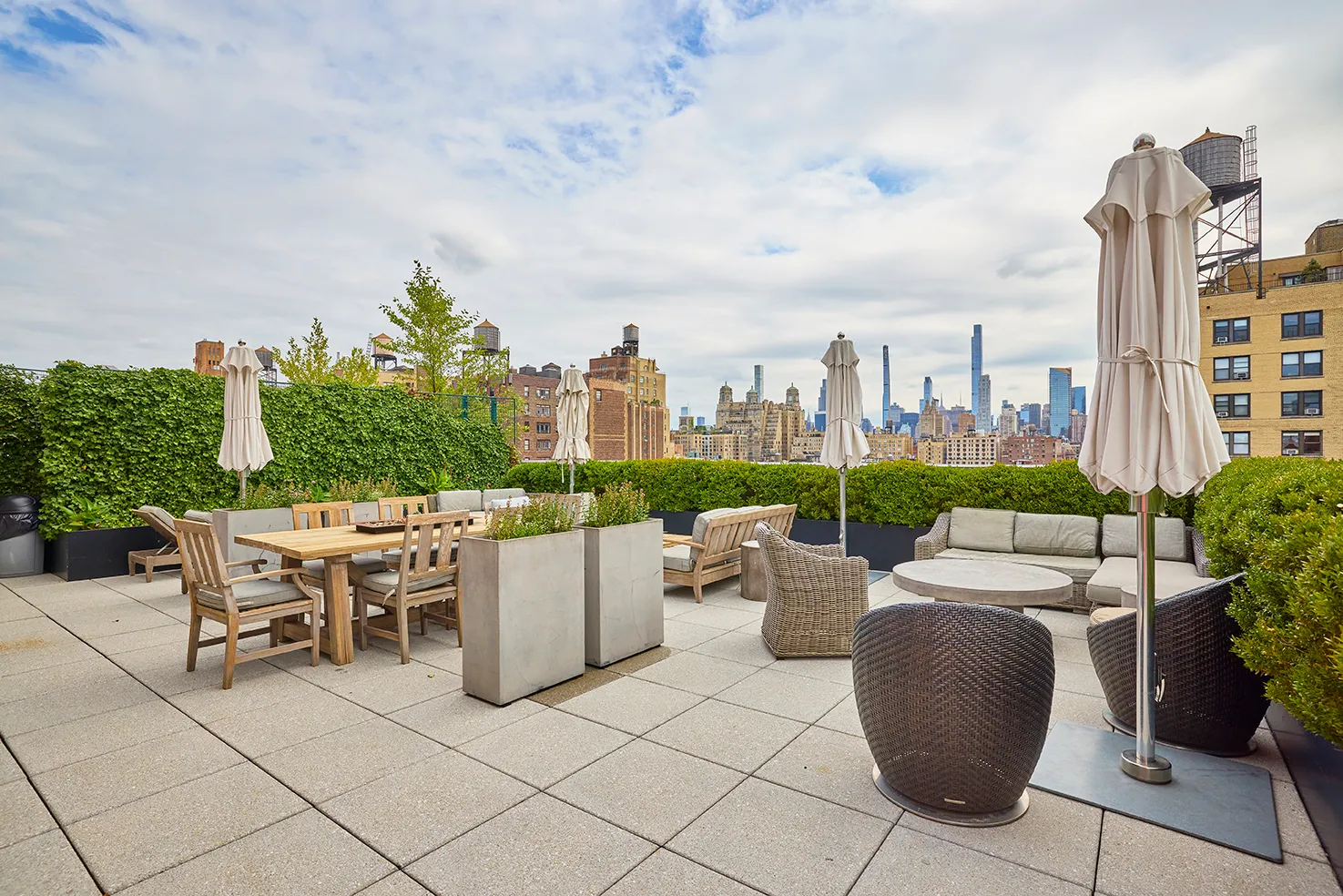 a view of a terrace with furniture and garden