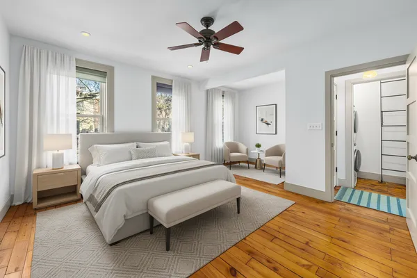 a spacious bedroom with a bed and window