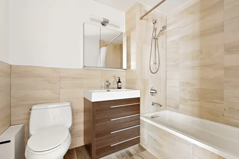 a bathroom with a sink a toilet and a bathtub