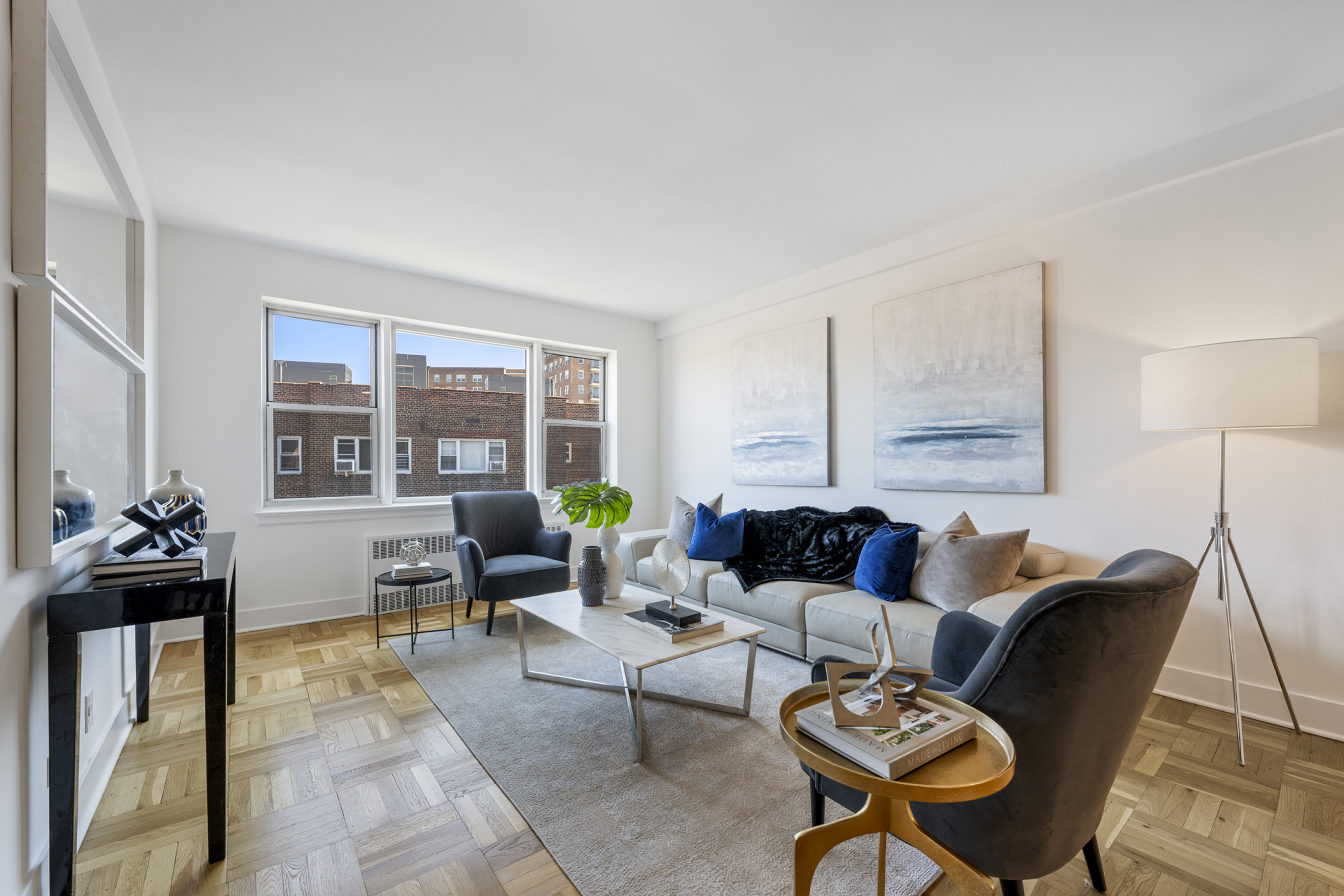 3850 Hudson Manor Terrace, Unit 6DW Bronx, NY 10463 - Photo 3 of 9 a living room with furniture and floor to ceiling windows