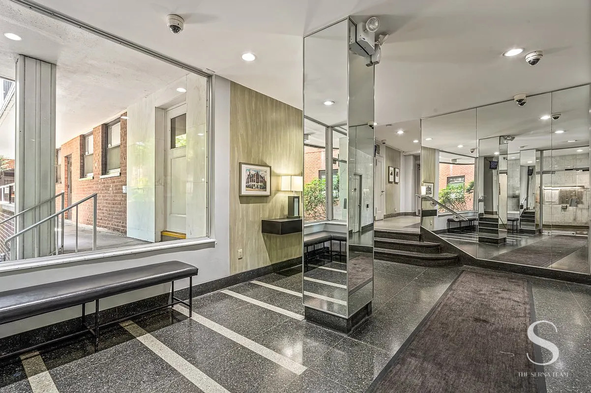 35-51 85th Street, Unit 4F Queens, NY 11372 - Photo 9 of 13 a lobby with furniture and a large window