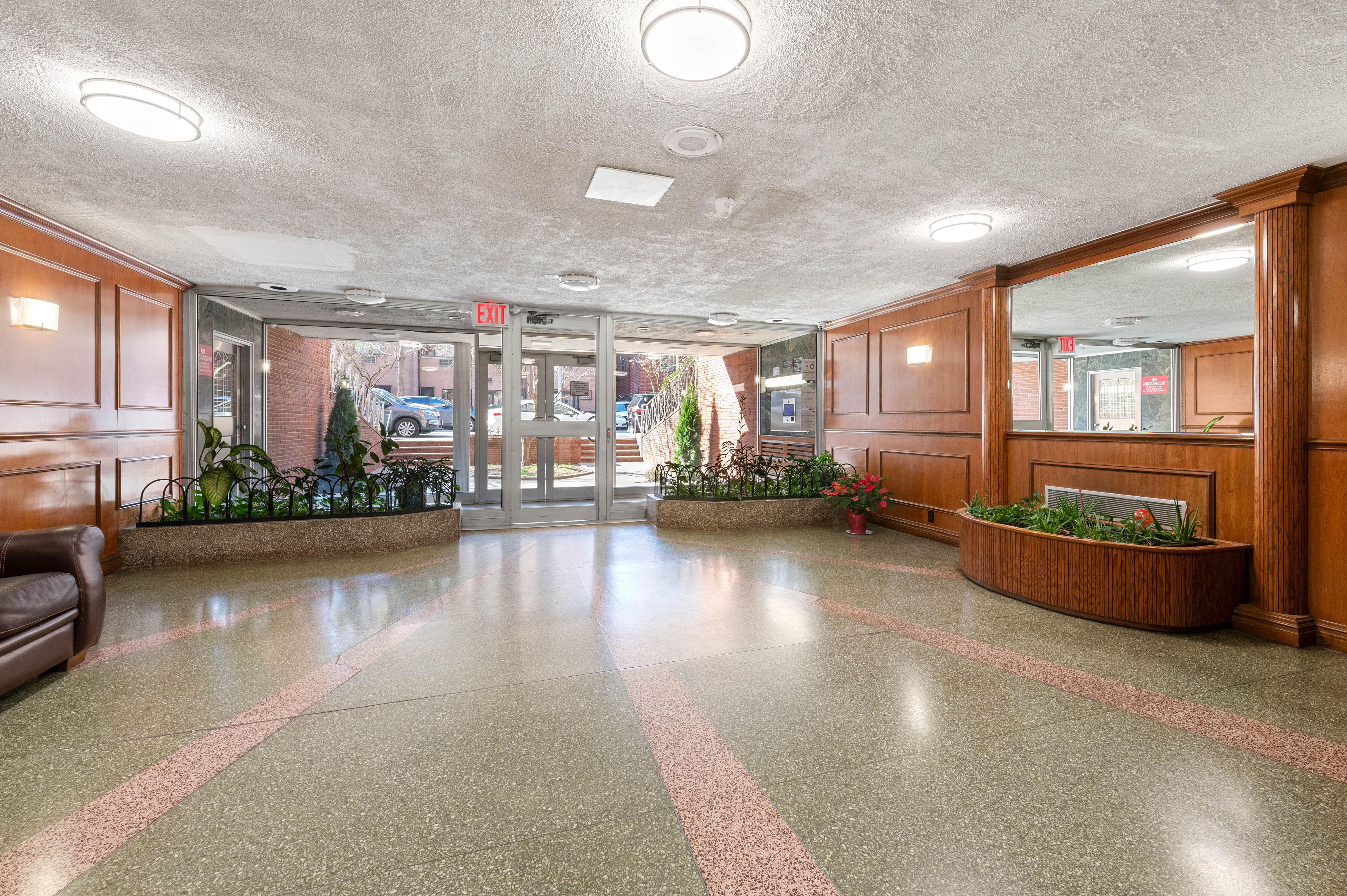 65-15 38th Avenue, Unit 1G Queens, NY 11377 - Photo 8 of 12 a view of a living room and kitchen