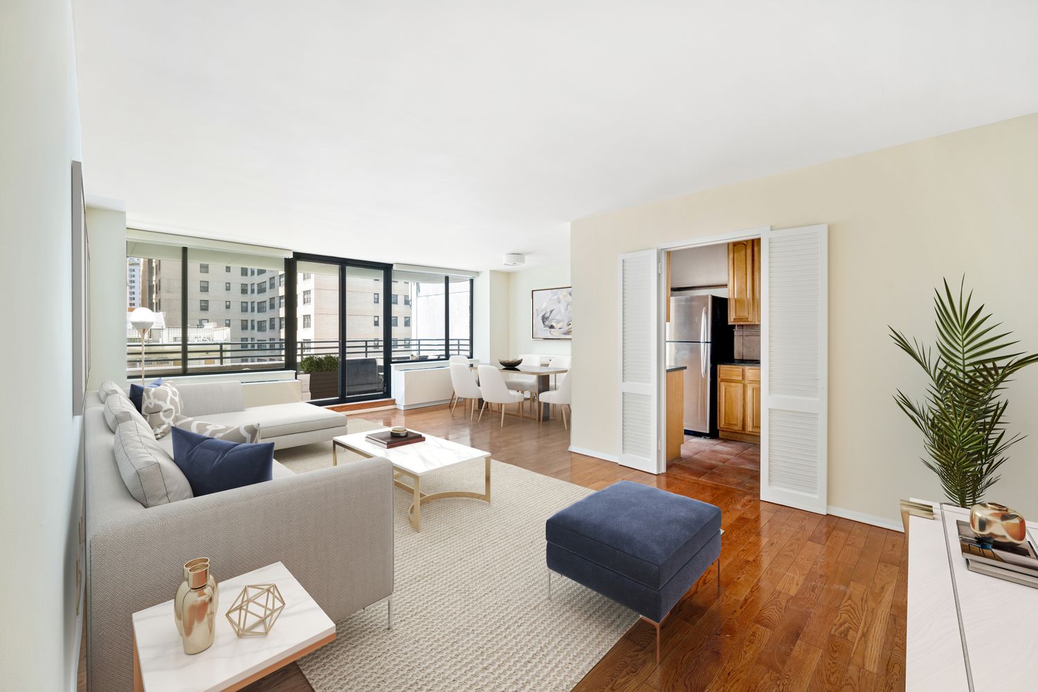 a living room with furniture and a floor to ceiling window