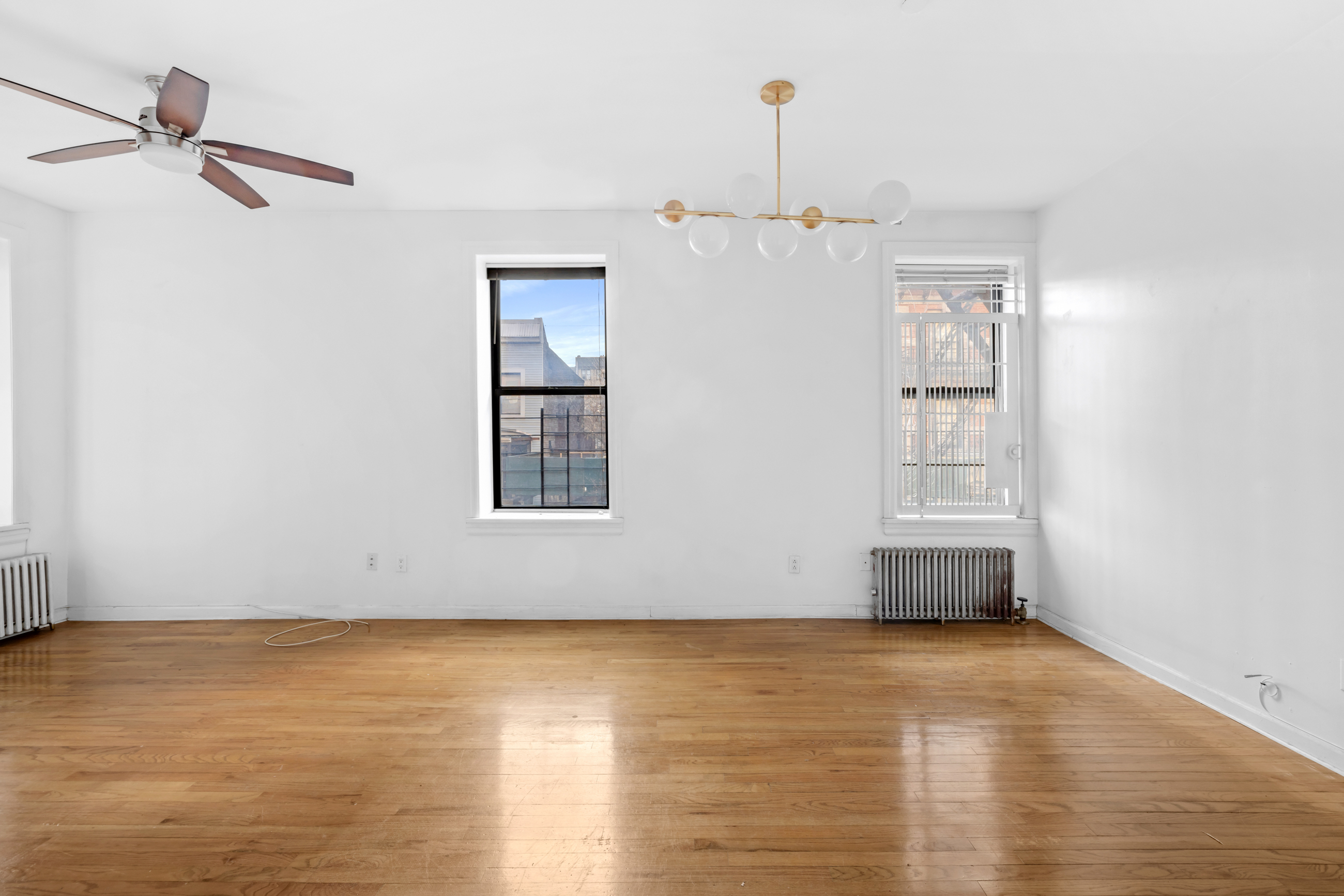 469 West 166th Street, Unit 2C Manhattan, NY 10032 - Photo 4 of 13 a view of an empty room with a window