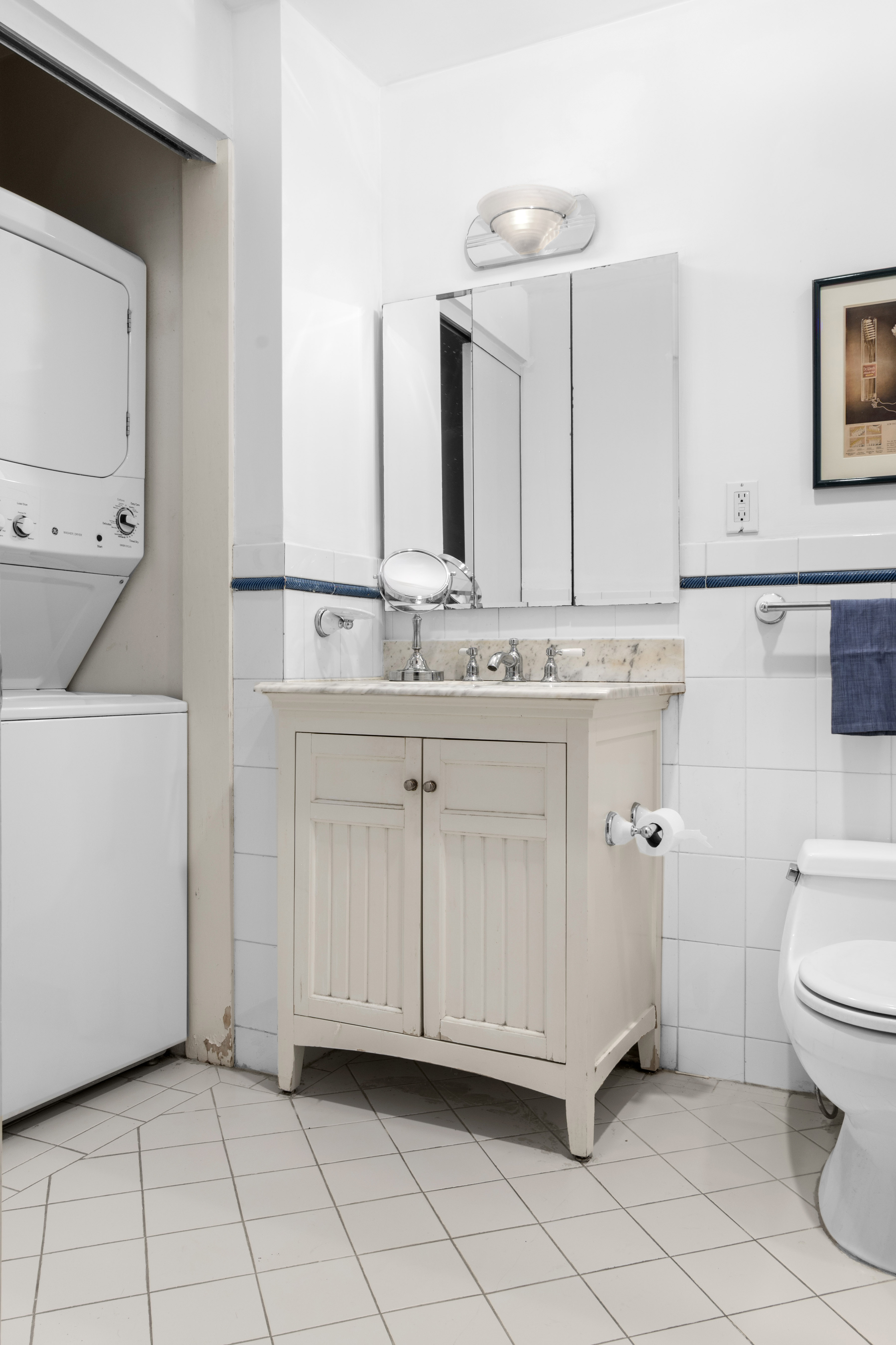 16 Sutton Place, Unit 1A/1B Manhattan, NY 10022 - Photo 20 of 25 a bathroom with a sink toilet and mirror
