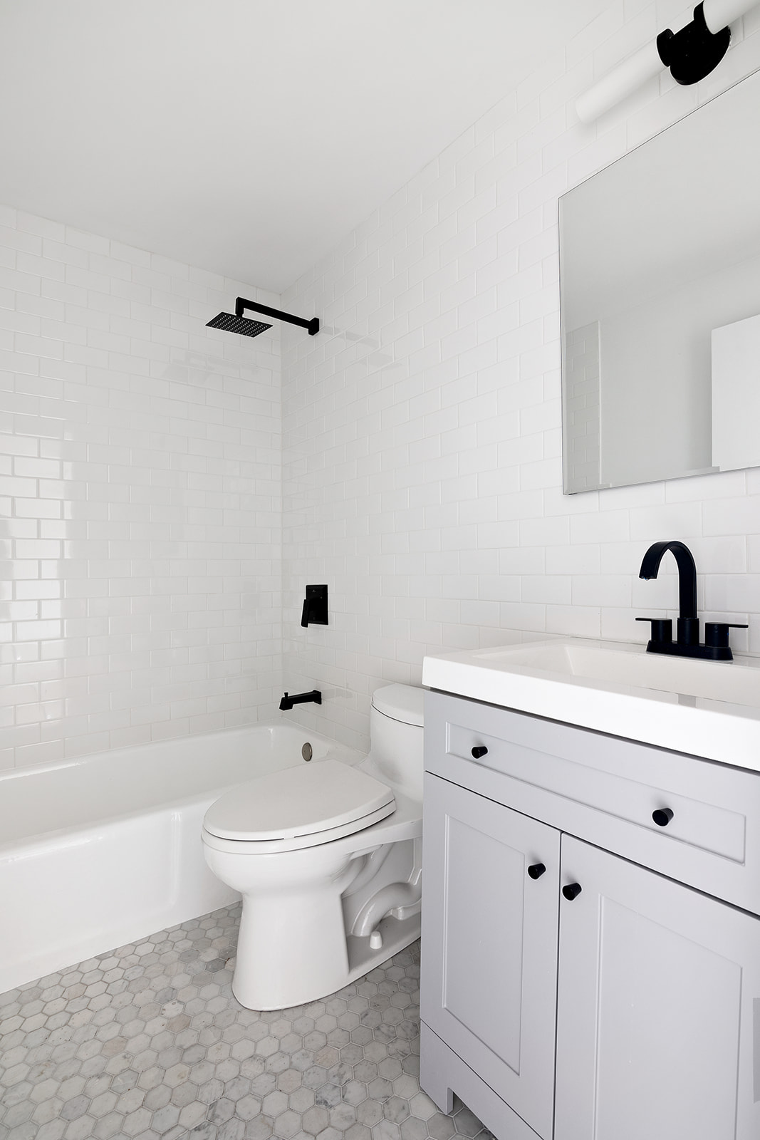270 West 17th Street, Unit 9A Manhattan, NY 10011 - Photo 6 of 6 a bathroom with a sink a toilet and a bathtub