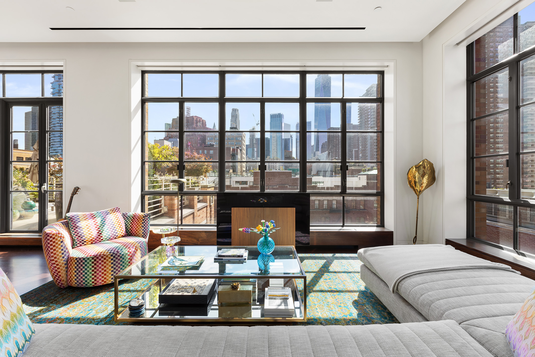 7 Hubert Street, Unit 8A Manhattan, NY 10013 - Photo 5 of 19 a living room filled with furniture and a large window