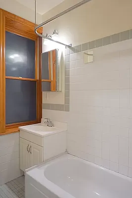 114 East 7th Street, Unit 1 Manhattan, NY 10009 - Photo 6 of 7 a bathroom with a sink a toilet and shower