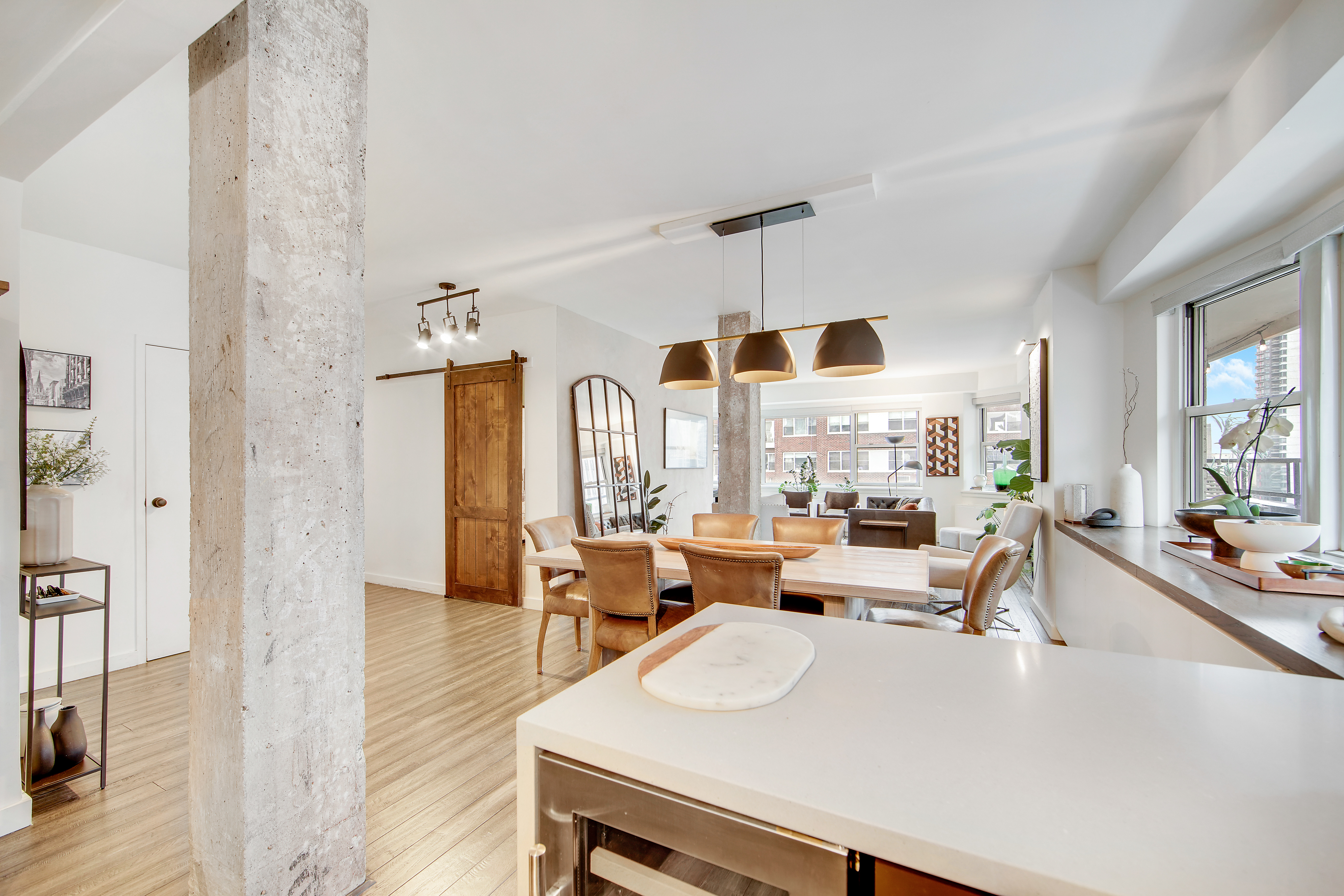 175 East 62nd Street, Unit 18B Manhattan, NY 10065 - Photo 3 of 18 a living room with fireplace furniture and a large window
