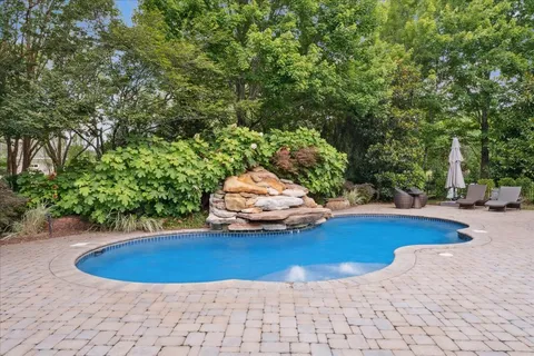 a view of a swimming pool with an outdoor space