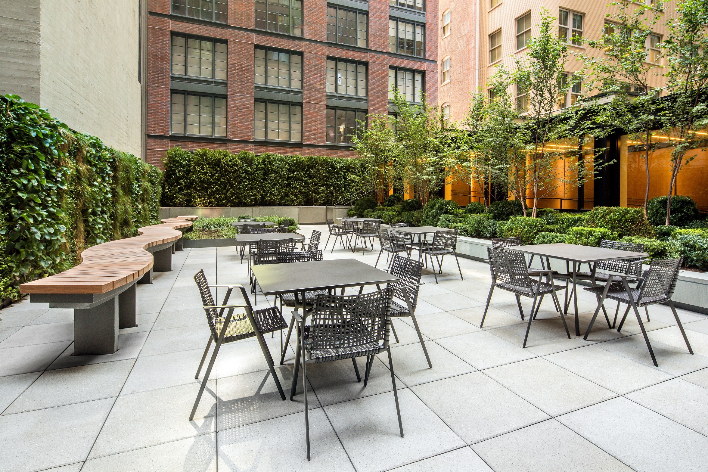 70 Charlton Street, Unit 16C Manhattan, NY 10014 - Photo 27 of 31 a view of a patio with a table and chairs and potted plants