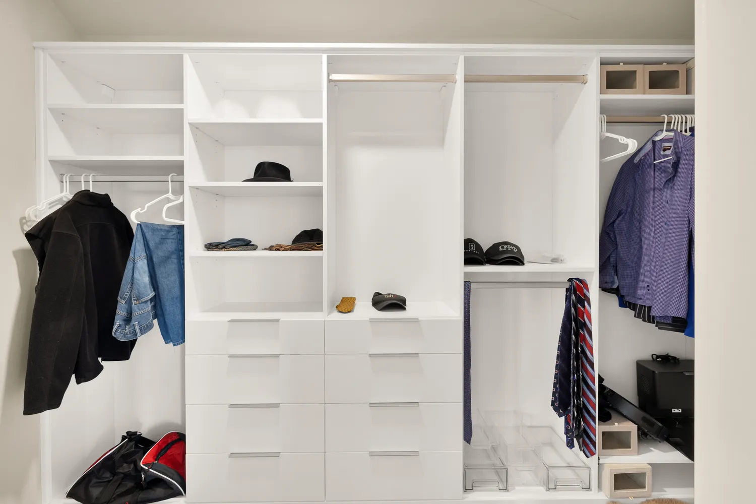 a bedroom with a bed and large windows