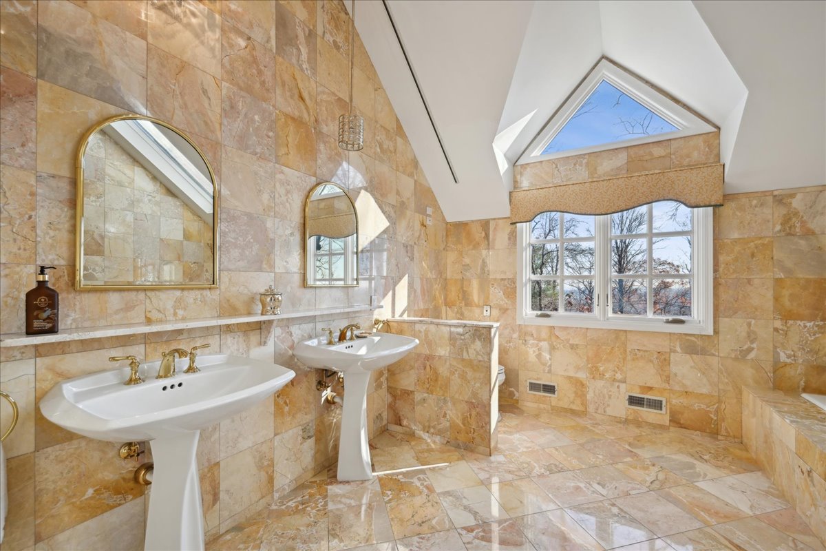 Johnston Drive Watchung, NJ 07069 - Photo 44 of 85 a bathroom with a sink and a mirror