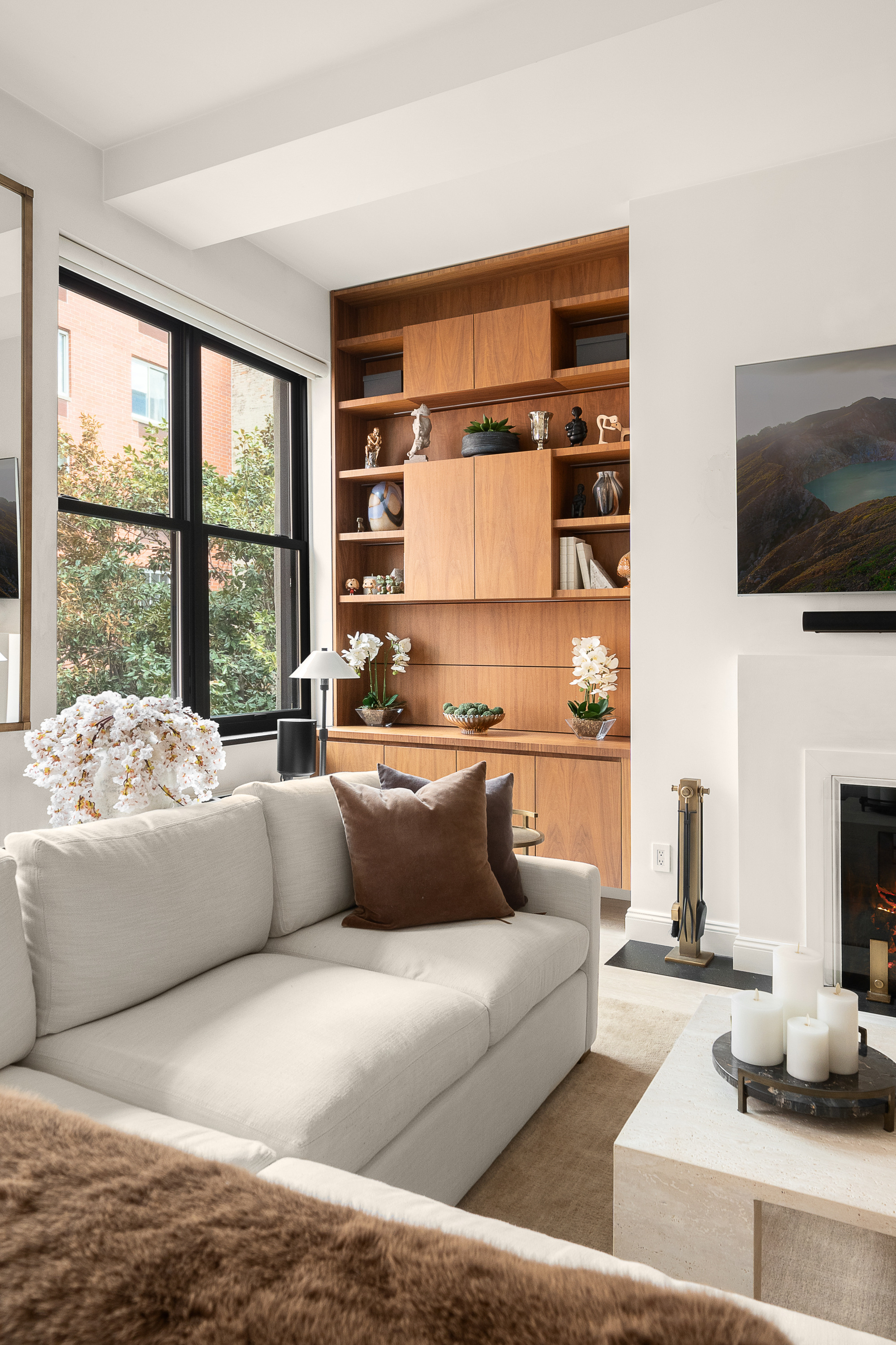 521 West 47th Street, Unit 3B Manhattan, NY 10036 - Photo 3 of 15 a living room with furniture and a flat screen tv