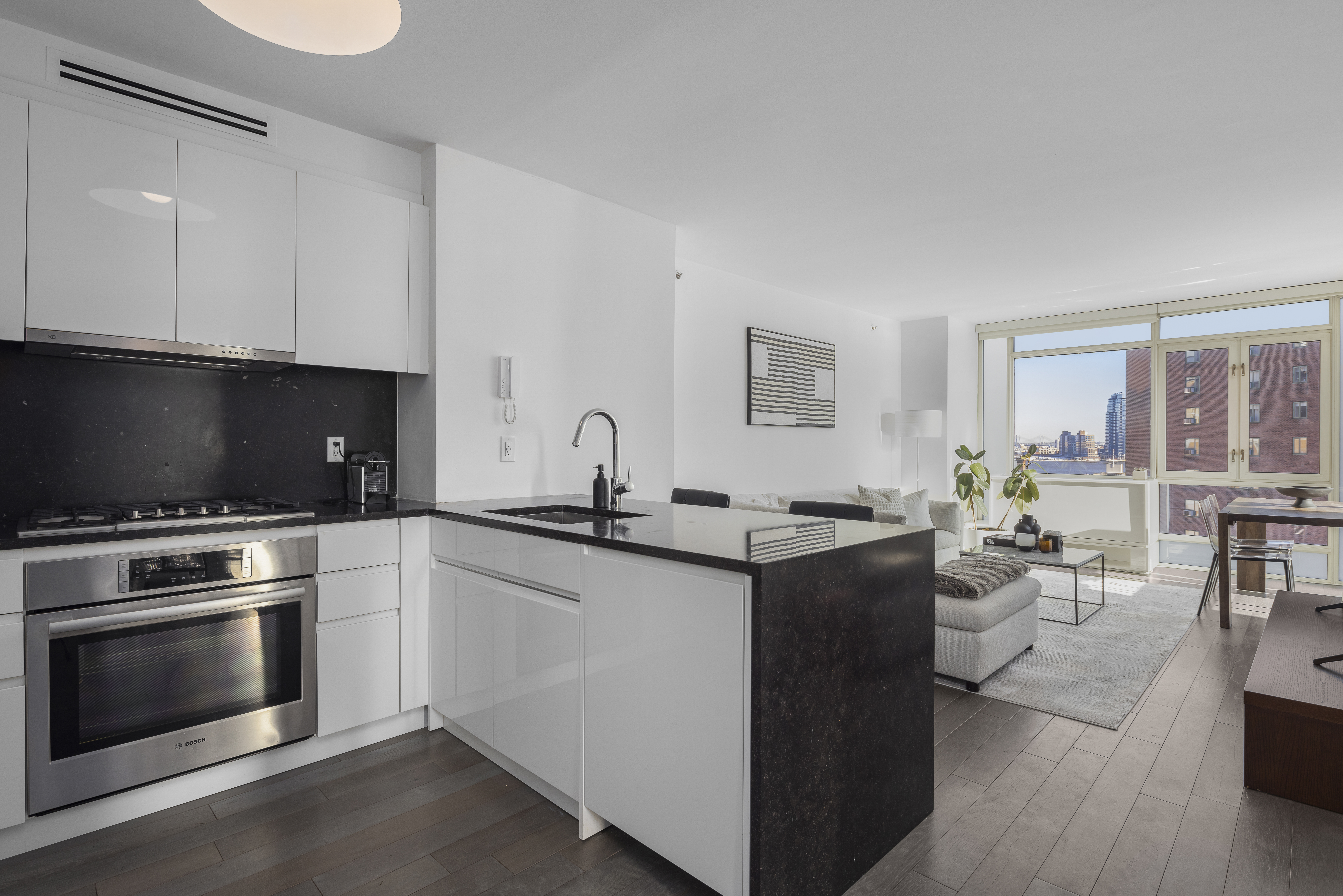 a kitchen with a stove a sink and a refrigerator