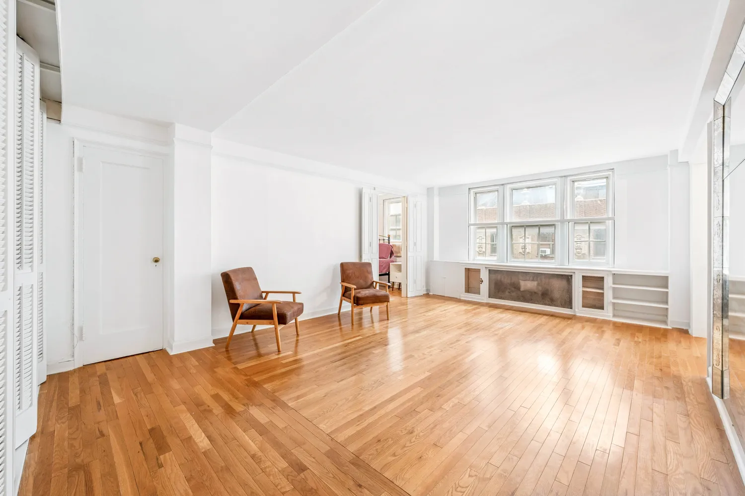 a view of a livingroom with furniture and a flat screen tv