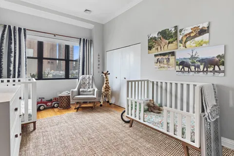a bedroom with furniture and a window