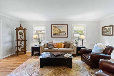 a living room with furniture or couch and a window