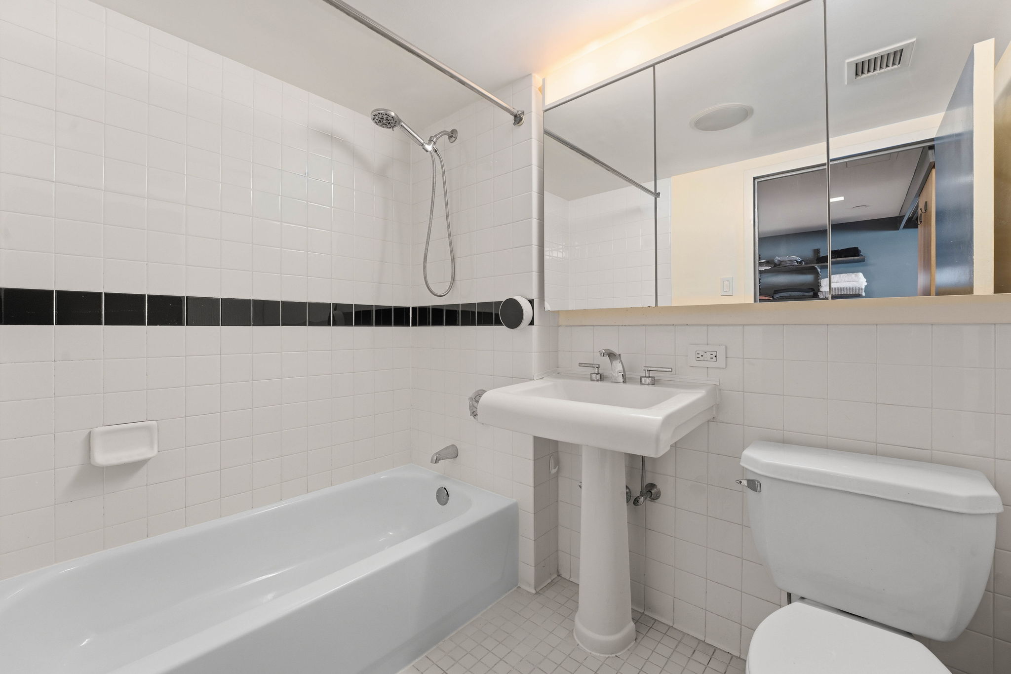 300 West 145th Street, Unit 6G Manhattan, NY 10039 - Photo 6 of 19 a bathroom with a sink a toilet and shower