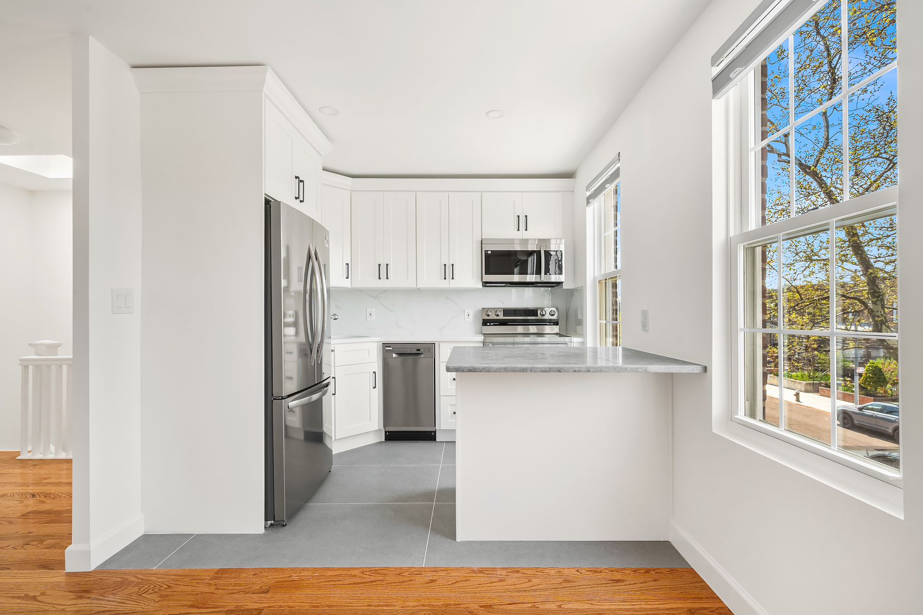 50-35 46th Street, Unit 2 Queens, NY 11377 - Photo 4 of 7 a kitchen with stainless steel appliances a refrigerator and a stove top oven