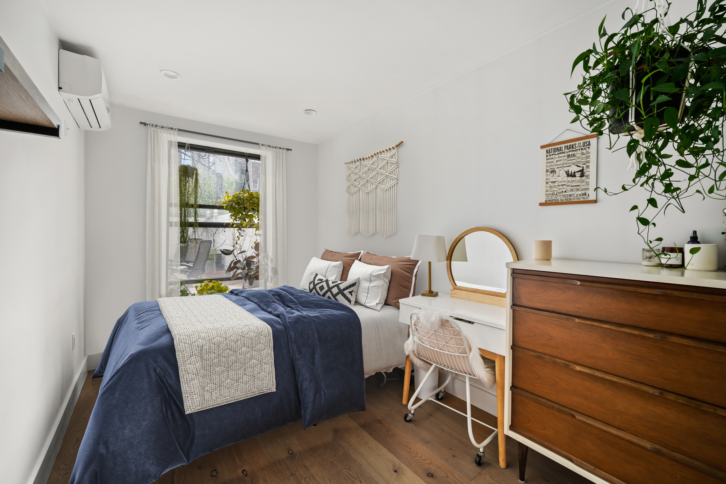 158 15th Street, Unit 1B Brooklyn, NY 11215 - Photo 6 of 14 a bedroom with a bed and a potted plant on the dresser