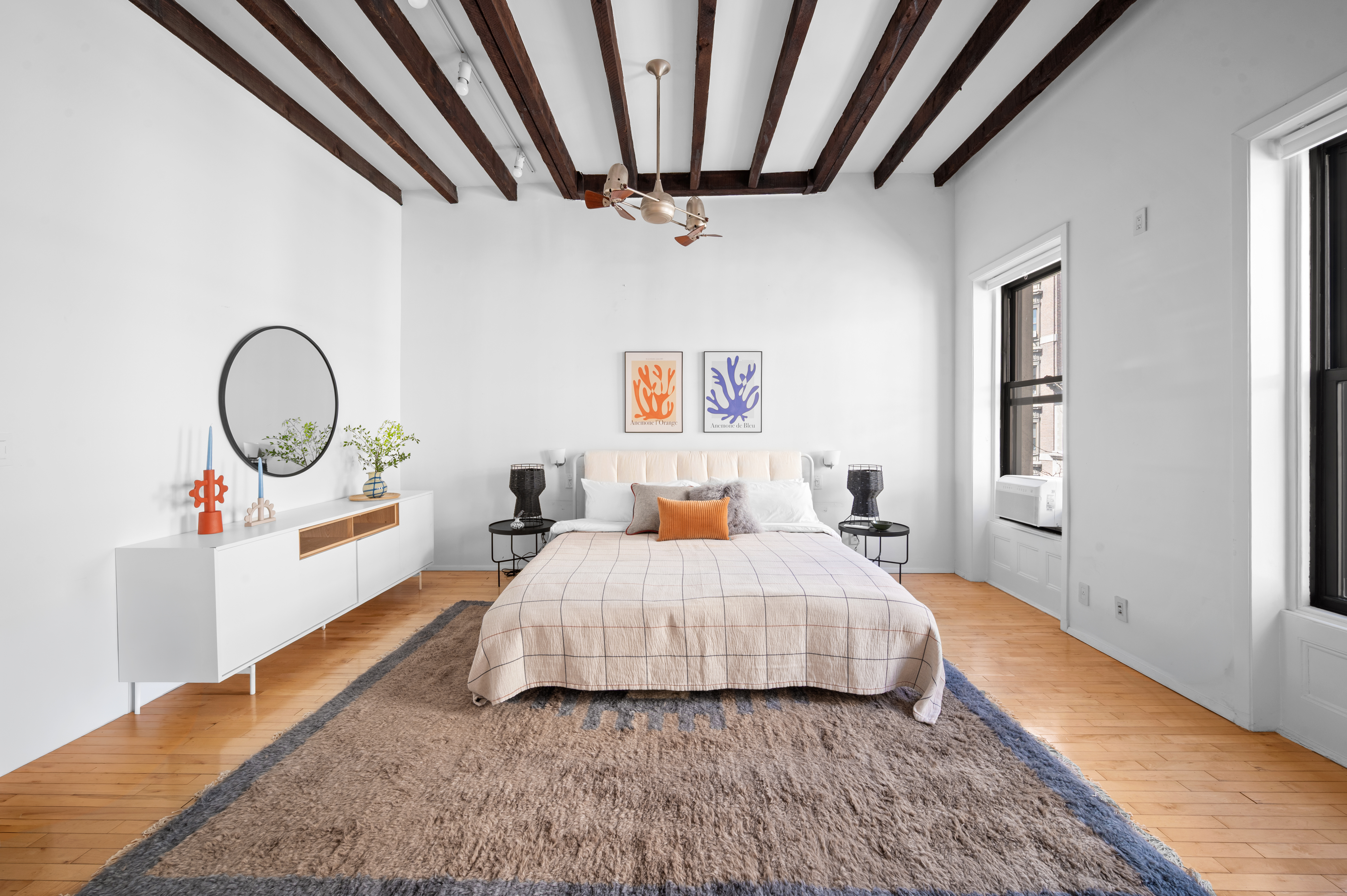 206 West 85th Street, Unit 5 Manhattan, NY 10024 - Photo 12 of 15 a bedroom with a bed a couch and dresser