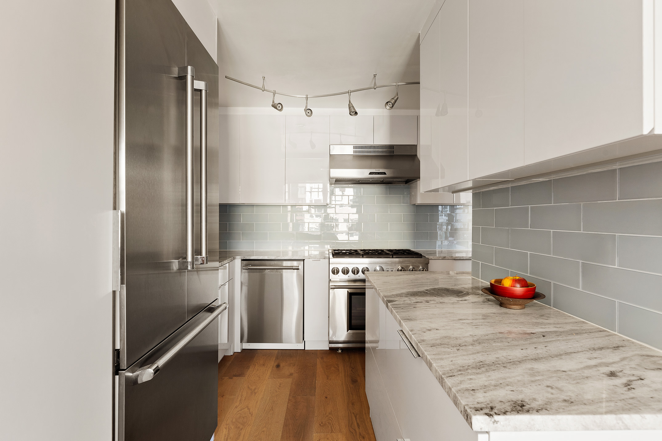444 East 86th Street, Unit 15G Manhattan, NY 10028 - Photo 2 of 12 a kitchen with stainless steel appliances granite countertop a refrigerator and a stove