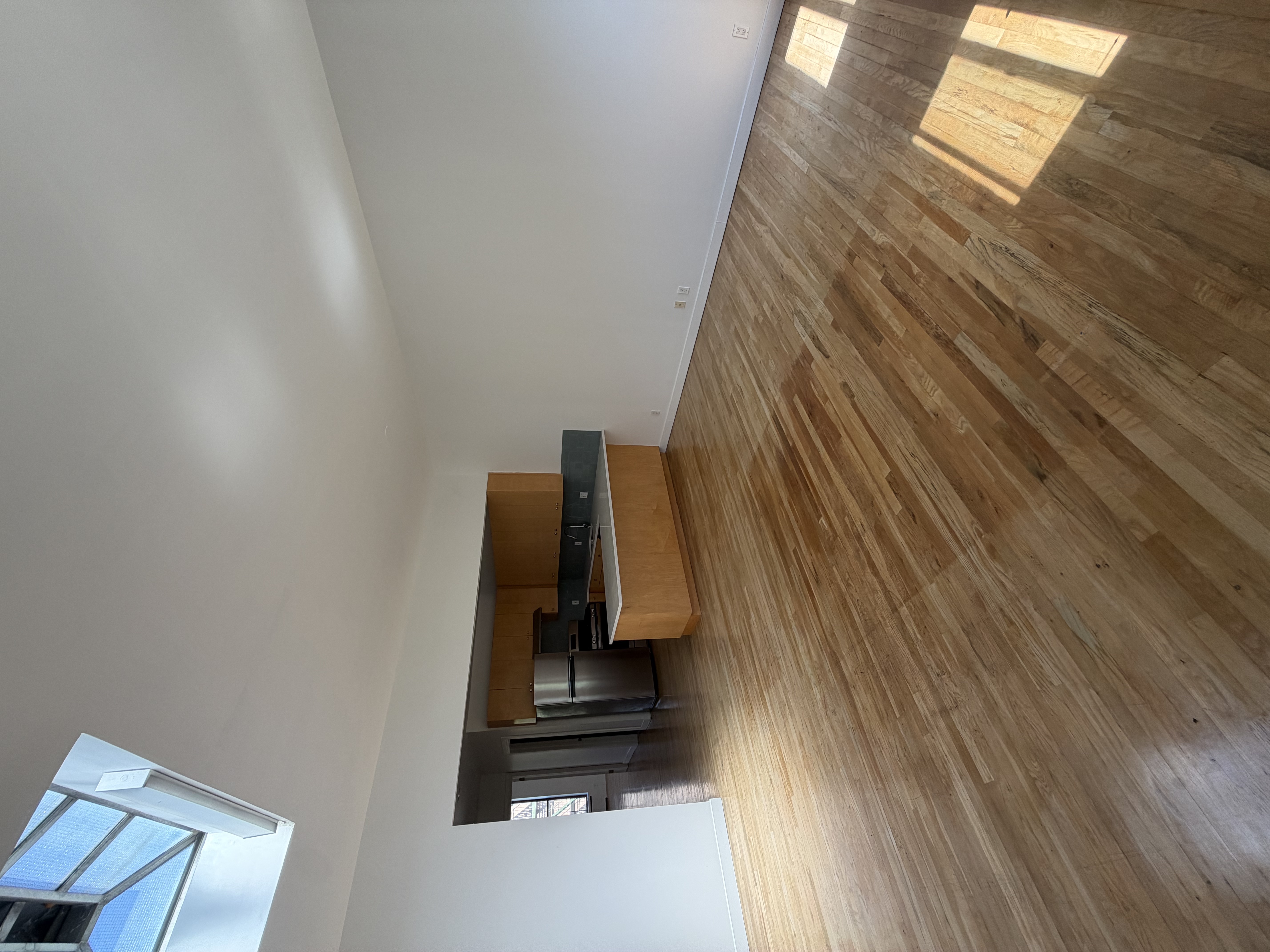 23 West 127th Street, Unit 3 Manhattan, NY 10027 - Photo 2 of 11 a room with wooden floor