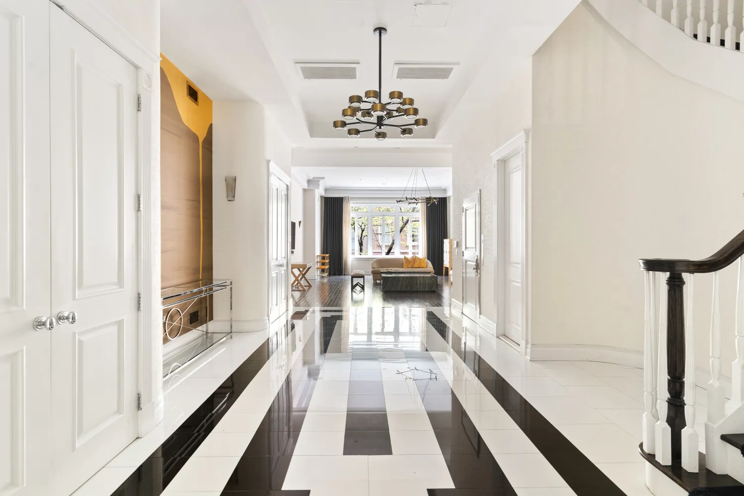 a view of a hallway with a chandelier