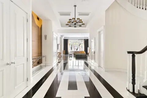 a view of a hallway with a chandelier