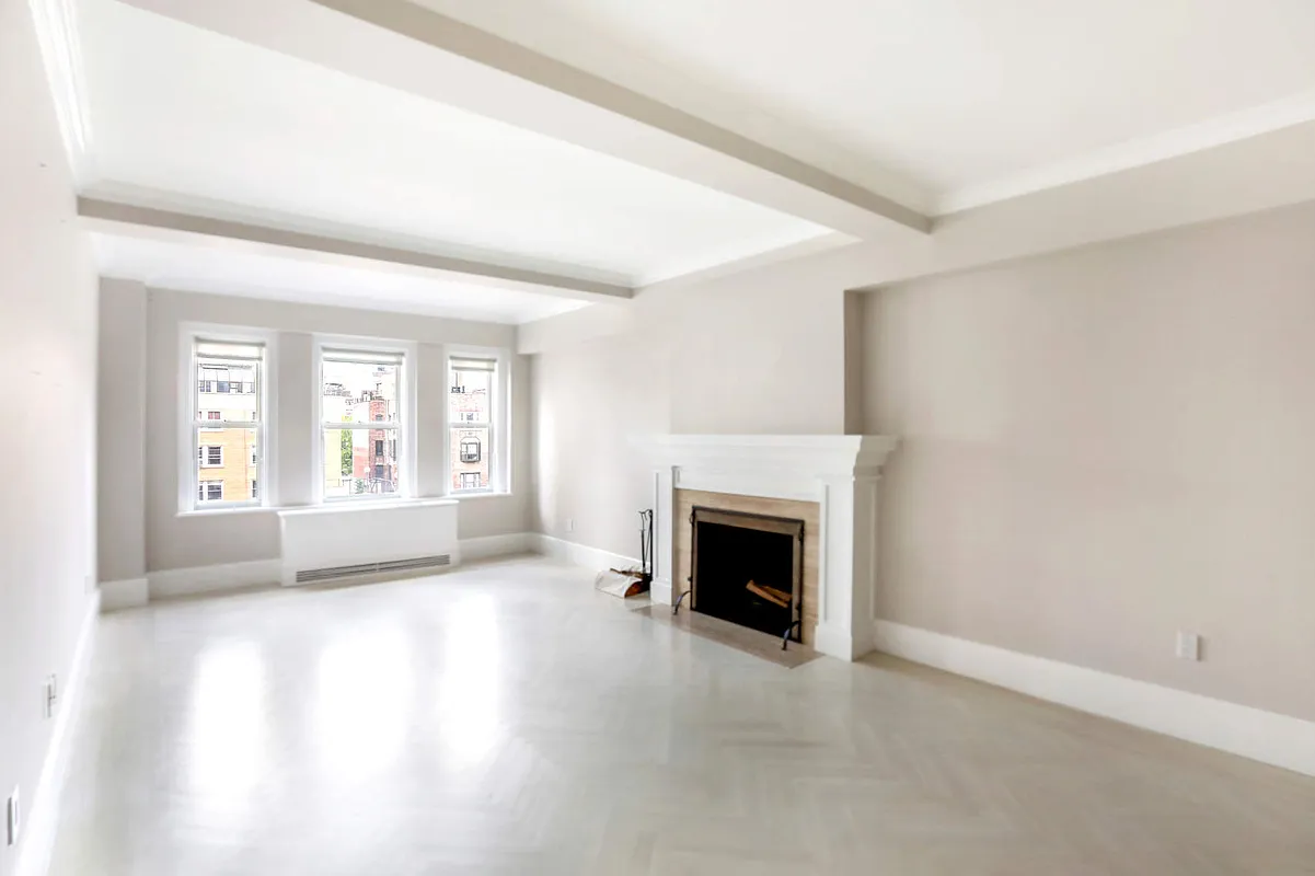 167 East 82nd Street, Unit 9B Manhattan, NY 10028 - Photo 2 of 15 a view of an empty room with a window and fireplace